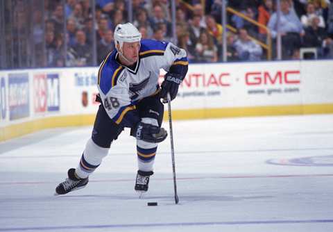 25 Feb 2000: Scott Young #48 of the St. Louis Blues controls the puck during a game against the Colorado Avalanche at the Kiel Center in St. Louis , Missouri. The Blues defeated the Avalanche 4-2. Mandatory Credit: Elsa Hasch /Allsport