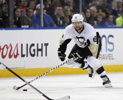 Feb 21, 2016; Buffalo, NY, USA; Pittsburgh Penguins right wing Phil Kessel (81) heads into the Buffalo Sabres zone during the third period at First Niagara Center. Penguins beat the Sabres 4-3. Mandatory Credit: Kevin Hoffman-USA TODAY Sports