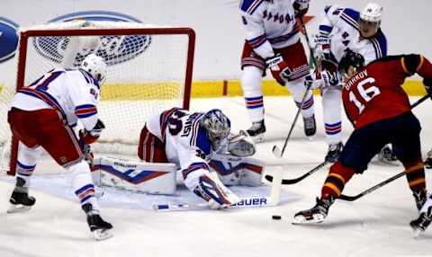 Nov 21, 2015; Sunrise, FL, USA; New York Rangers goalie Henrik Lundqvist (30) makes a save on a shot by Florida Panthers center Aleksander Barkov (16) as left wing Rick Nash (61) defends in the third period at BB&T Center. Mandatory Credit: Robert Mayer-USA TODAY Sports