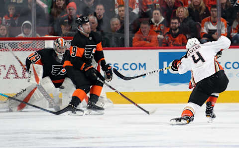 PHILADELPHIA, PA – FEBRUARY 09: Cam Fowler #4 of the Anaheim Ducks shoots the puck towards Ivan Provorov #9 and Carter Hart #79 of the Philadelphia Flyers on February 9, 2019 at the Wells Fargo Center in Philadelphia, Pennsylvania. (Photo by Len Redkoles/NHLI via Getty Images)