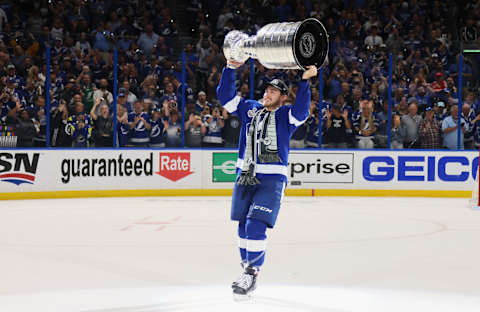 TAMPA, FLORIDA – JULY 07: Ross Colton #79 of the Tampa Bay Lightning celebrates with the Stanley Cup following the victory over the Montreal Canadiens in Game Five of the 2021 NHL Stanley Cup Final at the Amalie Arena on July 07, 2021 in Tampa, Florida. The Lightning defeated the Canadiens 1-0 to take the series four games to one. (Photo by Bruce Bennett/Getty Images)