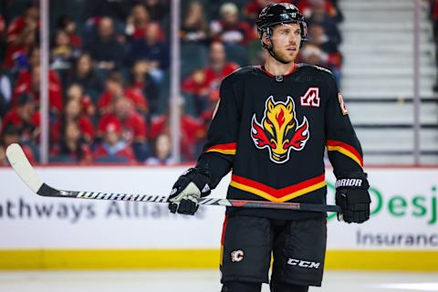 Nov 18, 2023; Calgary, Alberta, CAN; Calgary Flames center Elias Lindholm (28) against New York Islanders during the second period at Scotiabank Saddledome. Mandatory Credit: Sergei Belski-USA TODAY Sports