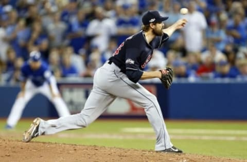 Oct 19, 2016; Toronto, Ontario, CAN; Cleveland Indians relief pitcher Andrew Miller (24) pitches during the seventh inning against the Toronto Blue Jays in game five of the 2016 ALCS playoff baseball series at Rogers Centre. Mandatory Credit: John E. Sokolowski-USA TODAY Sports