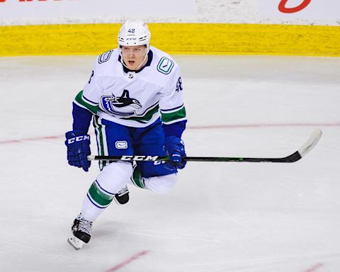 CALGARY, AB – JANUARY 18: Olli Juolevi #48 of the Vancouver Canucks in action against the Calgary Flames during an NHL game at Scotiabank Saddledome on January 18, 2021 in Calgary, Alberta, Canada. (Photo by Derek Leung/Getty Images)