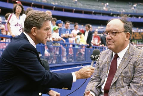 NEW YORK – CIRCA 1990: CBS broadcaster and former baseball player Tim McCarver talks with Commissioner Fay Vincent prior to the start of a Major League Baseball game circa 1990 at Shea Stadium in the Queens borough of New York City. (Photo by Focus on Sport/Getty Images)