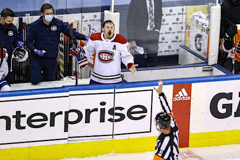 TORONTO, ONTARIO – AUGUST 19: Brendan Gallagher #11 of the Montreal Canadiens complains to referee Kyle Rehman #10 as he bleeds from the mouth for the lack of a penalty call against the Philadelphia Flyers during the third period in Game Five of the Eastern Conference First Round during the 2020 NHL Stanley Cup Playoffs at Scotiabank Arena on August 19, 2020 in Toronto, Ontario. (Photo by Elsa/Getty Images)