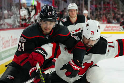 New Jersey Devils Jonas Siegenthaler (71) and Carolina Hurricanes Seth Jarvis (24): James Guillory-USA TODAY Sports