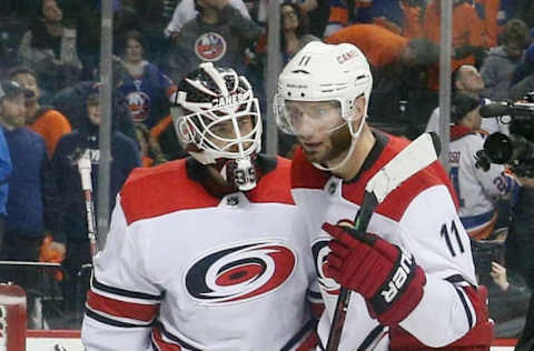 NEW YORK, NEW YORK – APRIL 28:Curtis McElhinney #35 and Jordan Staal #11 of the Carolina Hurricanes celebrate their 2-1 victory over the New York Islanders in Game Two of the Eastern Conference Second Round during the 2019 NHL Stanley Cup Playoffs at the Barclays Center on April 28, 2019 in the Brooklyn borough of New York City. (Photo by Bruce Bennett/Getty Images)