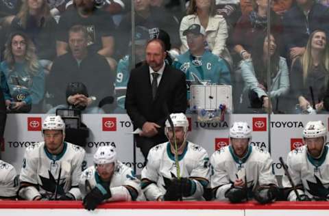 DENVER, COLORADO – MAY 06: Head coach Peter DeBoer of the San Jose Sharks watches as his team plays the Colorado Avalanche in the first period during Game Six of the Western Conference Second Round during the 2019 NHL Stanley Cup Playoffs at the Pepsi Center on May 6, 2019 in Denver, Colorado. (Photo by Matthew Stockman/Getty Images)