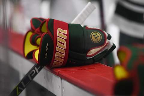 CHICAGO, IL – DECEMBER 17: A general view of a Minnesota Wild’s player’s gloves on the bench during a game between the Chicago Blackhawks and the Minnesota Wild on December 17, 2017, at the United Center in Chicago, IL. (Photo by Patrick Gorski/Icon Sportswire via Getty Images)