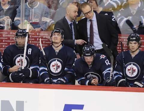 Mar 26, 2015; Winnipeg, Manitoba, CAN; Winnipeg Jets head coach Paul Maurice and Pascal Vincent reacts from behind the bench during the first period against the Montreal Canadiens at MTS Centre. Mandatory Credit: James Carey Lauder-USA TODAY Sports