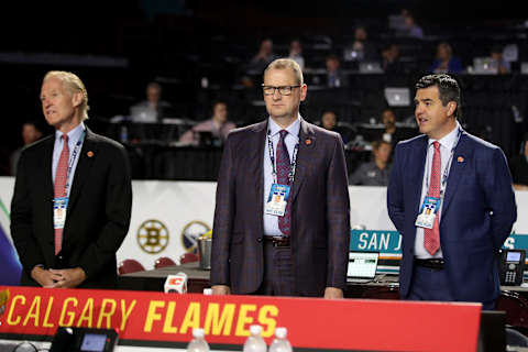 VANCOUVER, BRITISH COLUMBIA – JUNE 21: (L-R) Don Maloney, Brad Treliving and Brad Pascal of the Calgary Flames attend the first round of the 2019 NHL Draft at Rogers Arena on June 21, 2019 in Vancouver, Canada. (Photo by Bruce Bennett/Getty Images)