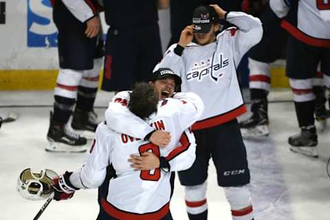 TAMPA BAY, FL – MAY 23:Washington Capitals defenseman John Carlson (74) hugs left wing Alex Ovechkin (8) at the end of Game 7 of the Eastern Conference Finals between the Washington Capitals and the Tampa Bay Lightning on Wednesday, May 23, 2018. (Photo by Jonathan Newton/The Washington Post via Getty Images)