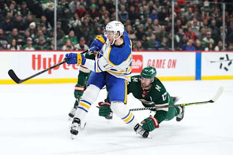 Dec 16, 2021; Saint Paul, Minnesota, USA; Buffalo Sabres center Mark Jankowski (17) shoots the puck past Minnesota Wild left wing Marcus Foligno (17) in the first period at Xcel Energy Center. Mandatory Credit: David Berding-USA TODAY Sports