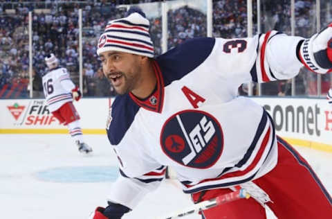 Oct 23, 2016; Winnipeg, Manitoba, CAN; Winnipeg Jets defenseman Dustin Byfuglien (33) prior to the game between Edmonton Oilers and the Winnipeg Jets at the 2016 Heritage Classic ice hockey game at Investors Group Field. Mandatory Credit: Bruce Fedyck-USA TODAY Sports