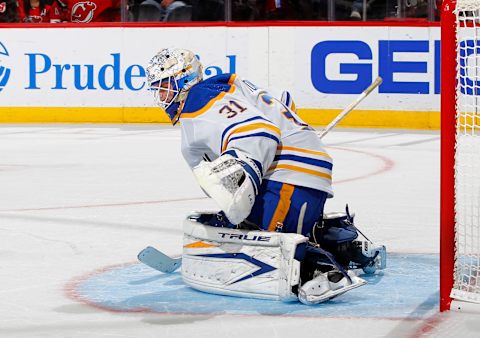 NEWARK, NEW JERSEY – OCTOBER 23: Dustin Tokarski #31 of the Buffalo Sabres in action against the New Jersey Devils at Prudential Center on October 23, 2021 in Newark, New Jersey. The Devils defeated the Sabres 2-1 in overtime. (Photo by Jim McIsaac/Getty Images)