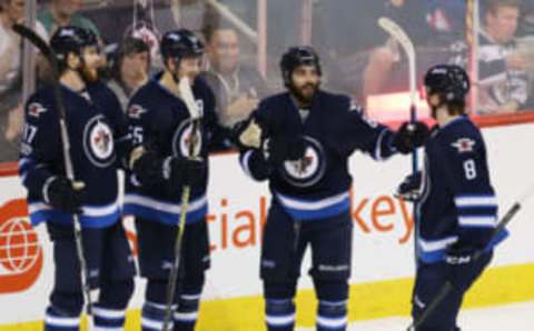 Winnipeg Jets left wing Adam Lowry (17) celebrates with teammates (Bruce Fedyck-USA TODAY Sports)