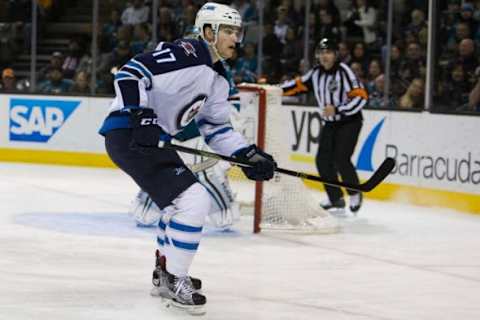 Jan 2, 2016; San Jose, CA, USA; Winnipeg Jets left wing Adam Lowry (17) skates during the third period at SAP Center at San Jose. The Winnipeg Jets defeat the San Jose Sharks 4 to 1. Mandatory Credit: Neville E. Guard-USA TODAY Sports