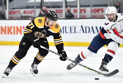 May 21, 2021; Boston, Massachusetts, USA; Boston Bruins left wing Taylor Hal (71) controls the puck past Washington Capitals defenseman Justin Schultz (2) during the second period in game four of the first round of the 2021 Stanley Cup Playoffs at TD Garden. Mandatory Credit: Bob DeChiara-USA TODAY Sports