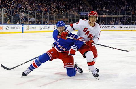 NEW YORK, NEW YORK – NOVEMBER 02: Nick Bonino #12 of the New York Rangers slows down Teuvo Teravainen #86 of the Carolina Hurricanes during the third period at Madison Square Garden on November 02, 2023 in New York City. The Rangers defeated the Hurricanes 2-1. (Photo by Bruce Bennett/Getty Images)