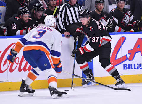 Oct 21, 2023; Buffalo, New York, USA; Buffalo Sabres center Casey Mittelstadt (37) tries to get the puck past New York Islanders defenseman Adam Pelech (3) in the second period at KeyBank Center. Mandatory Credit: Mark Konezny-USA TODAY Sports