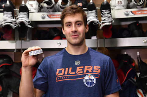 EDMONTON, AB – OCTOBER 25: Evan Bouchard #75 of the Edmonton Oilers poses after scoring his first NHL goal following the game against the Washington Capitals on October 25, 2018 at Rogers Place in Edmonton, Alberta, Canada. (Photo by Andy Devlin/NHLI via Getty Images)