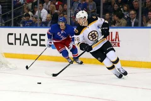 Sep 30, 2015; New York, NY, USA; Boston Bruins defenseman Colin Miller (48) carries the puck during the second period against the New York Rangers at Madison Square Garden. Mandatory Credit: Anthony Gruppuso-USA TODAY Sports