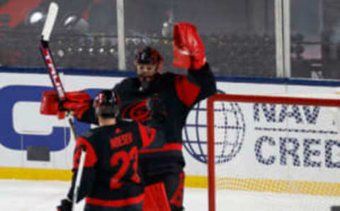 Feb 18, 2023; Raleigh, North Carolina, USA; Carolina Hurricanes goaltender Frederik Andersen (31) celebrates with Hurricanes right wing Stefan Noesen (23) after their game against the Washington Capitals in the 2023 Stadium Series ice hockey game at Carter-Finley Stadium. Mandatory Credit: Geoff Burke-USA TODAY Sports