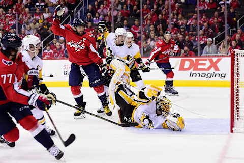 WASHINGTON, DC – NOVEMBER 07: T.J. Oshie #77 of the Washington Capitals scores a goal against Casey DeSmith #1 of the Pittsburgh Penguins in the third period at Capital One Arena on November 7, 2018 in Washington, DC. (Photo by Patrick McDermott/NHLI via Getty Images)