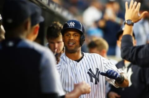 May 23, 2017; Bronx, NY, USA; New York Yankees left fielder Hicks (31) is congratulated in the dugout after hitting a solo home run against the Kansas City Royals during the fourth inning at Yankee Stadium. Mandatory Credit: Andy Marlin-USA TODAY Sports