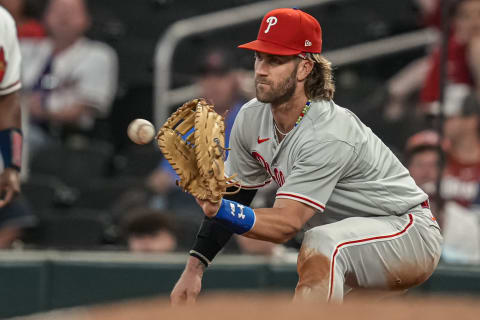 Sep 18, 2023; Cumberland, Georgia, USA; Philadelphia Phillies first baseman Bryce Harper (3) records the final out against the Atlanta Braves during the ninth inning at Truist Park. Mandatory Credit: Dale Zanine-USA TODAY Sports