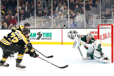 BOSTON, MA – NOVEMBER 23: Minnesota Wild goalie Alex Stalock (32) makes a left pad save on Boston Bruins right defenseman Charlie McAvoy (73) during a game between the Boston Bruins and the Minnesota Wild on November 23, 2019, at TD Garden in Boston, Massachusetts. (Photo by Fred Kfoury III/Icon Sportswire via Getty Images)