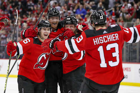 New Jersey Devils center Nico Hischier (13) celebrates with center Jack Hughes (86): Tom Horak-USA TODAY Sports