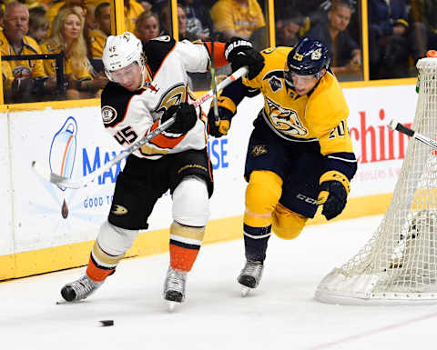 Apr 25, 2016; Nashville, TN, USA; Anaheim Ducks defenseman Sami Vatanen (45) skates behind the goal with pressure from Nashville Predators right winger Miikka Salomaki (20) during the first period in game six of the first round of the 2016 Stanley Cup Playoffs at Bridgestone Arena. Mandatory Credit: Christopher Hanewinckel-USA TODAY Sports