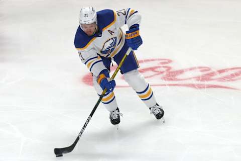 Feb 13, 2022; Montreal, Quebec, CAN; Buffalo Sabres right wing Kyle Okposo (21) skates with the puck against Montreal Canadiens during the first period at Bell Centre. Mandatory Credit: Jean-Yves Ahern-USA TODAY Sports