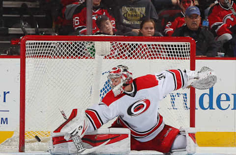 NEWARK, NJ – FEBRUARY 21: Antono Khudobin #31 of the Carolina Hurricanes makes a pad save against the New Jersey Devils during the game at the Prudential Center on February 21, 2015 in Newark, New Jersey. (Photo by Andy Marlin/NHLI via Getty Images)