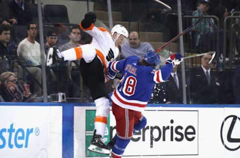 NEW YORK, NEW YORK – MARCH 01: Tyler Pitlick #18 of the Philadelphia Flyers is checked by Marc Staal #18 of the New York Rangers during the third period at Madison Square Garden on March 01, 2020, in New York City. The Flyers defeated the Rangers 5-3. (Photo by Bruce Bennett/Getty Images)