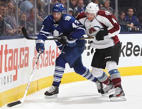 TORONTO, ON – OCTOBER 8: Tyson Barrie #4 of the Colorado Avalanche battles against Nazem Kadri #43 of the Toronto Maple Leafs during an NHL game at the Air Canada Centre on October 8, 2013 in Toronto, Ontario, Canada. The Avalanche defeated the Leafs 2-1. (Photo by Claus Andersen/Getty Images)