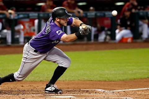 PHOENIX, AZ – SEPTEMBER 23: Garrett Hampson #1 of the Colorado Rockies bunts during the top of the second inning against the Arizona Diamondbacks at Chase Field on September 23, 2018 in Phoenix, Arizona. (Photo by Chris Coduto/Getty Images)