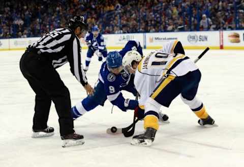 Feb 12, 2016; Tampa, FL, USA; Tampa Bay Lightning center Tyler Johnson (9) and Nashville Predators center Calle Jarnkrok (19) go after the puck during a face off during the second period at Amalie Arena. Mandatory Credit: Kim Klement-USA TODAY Sports