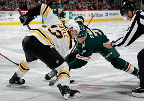 ST. PAUL, MN – APRIL 04: Charlie Coyle #13 of the Boston Bruins and Nico Sturm #7 of the Minnesota Wild face-off during a game at Xcel Energy Center on April 4, 2019 in St. Paul, Minnesota.(Photo by Bruce Kluckhohn/NHLI via Getty Images)