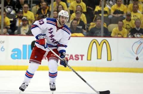 Apr 13, 2016; Pittsburgh, PA, USA; New York Rangers defenseman Keith Yandle (93) moves the puck against the Pittsburgh Penguins during the third period in game one of the first round of the 2016 Stanley Cup Playoffs at the CONSOL Energy Center. The Penguins won 5-2. Mandatory Credit: Charles LeClaire-USA TODAY Sports