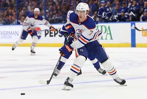 Nov 18, 2023; Tampa, Florida, USA; Edmonton Oilers center Ryan McLeod (71) passes the puck against the Tampa Bay Lightning during the second period at Amalie Arena. Mandatory Credit: Kim Klement Neitzel-USA TODAY Sports