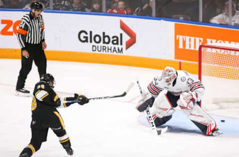 OSHAWA, ON – OCTOBER 18: Jamieson Rees #39 of the Sarnia Sting scores on Zachary Paputsakis #33 of the Oshawa Generals during an OHL game at the Tribute Communities Centre on October 18, 2019 in Oshawa, Ontario, Canada. (Photo by Chris Tanouye/Getty Images)