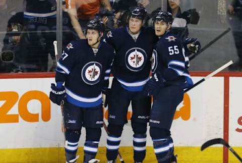 NHL Power Rankings: Winnipeg Jets right wing Patrik Laine (29) celebrates with teammates after scoring a goal during the second period against the Colorado Avalanche at MTS Centre. Mandatory Credit: Bruce Fedyck-USA TODAY Sports