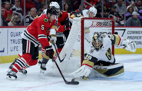 Vegas Golden Knights goaltender Marc-Andre Fleury (29) knocks the puck away from the Chicago Blackhawks’ Connor Murphy (5) in the first period at the United Center in Chicago on Tuesday, Oct. 22, 2019. The Golden Knights won, 2-1, in a shootout. (Chris Sweda/Chicago Tribune/Tribune News Service via Getty Images)