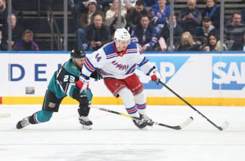 NEW YORK, NY – DECEMBER 18: Neal Pionk #44 of the New York Rangers skates with the puck against Brian Gibbons #23 of the Anaheim Ducks at Madison Square Garden on December 18, 2018 in New York City. The New York Rangers won 3-1. (Photo by Jared Silber/NHLI via Getty Images)