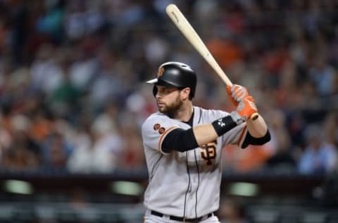 Jul 3, 2016; Phoenix, AZ, USA; San Francisco Giants first baseman Brandon Belt (9) bats in the seventh inning against the Arizona Diamondbacks at Chase Field. Mandatory Credit: Joe Camporeale-USA TODAY Sports