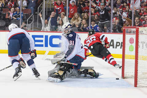 Apr 6, 2023; Newark, New Jersey, USA; New Jersey Devils center Jack Hughes (86) scores a goal past Columbus Blue Jackets goaltender Michael Hutchinson (31) during the first period at Prudential Center. Mandatory Credit: Vincent Carchietta-USA TODAY Sports