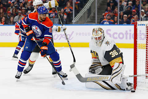 Nov 28, 2023; Edmonton, Alberta, CAN; Edmonton Oilers forward Evander Kane (91) tips a shot just wide of Vegas Golden Knights goaltender Logan Thompson (36) during the third period at Rogers Place. Mandatory Credit: Perry Nelson-USA TODAY Sports